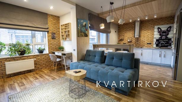 Loft studio with fireplace, new building, Kyiv - apartment by the day