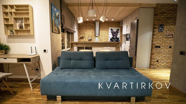 Loft studio with fireplace, new building, Kyiv - apartment by the day