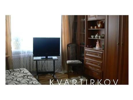 The apartment is located in the city center, on the first fl