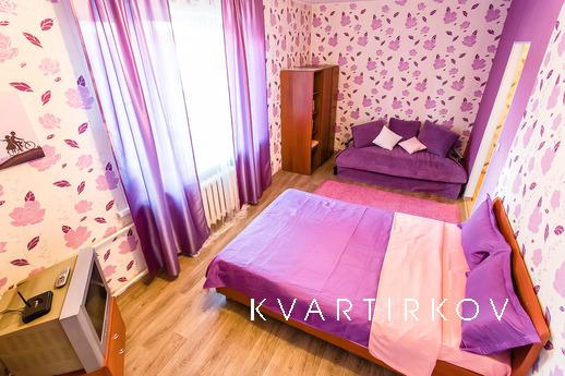 The interior of the bedroom in shades of lilac and lavender 