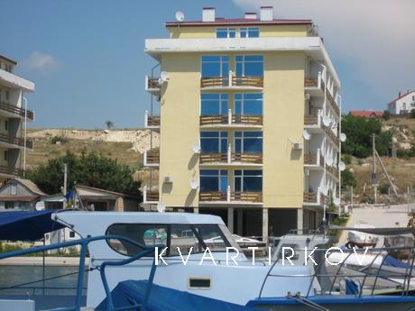 The apartment is located on the shore of the bay (25 m from 